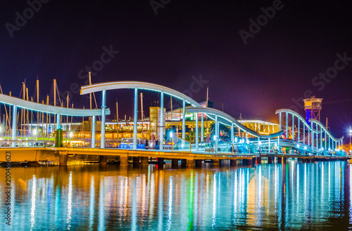 Photography Night view of Rambla de Mar promenade in Barcelona, Spain.