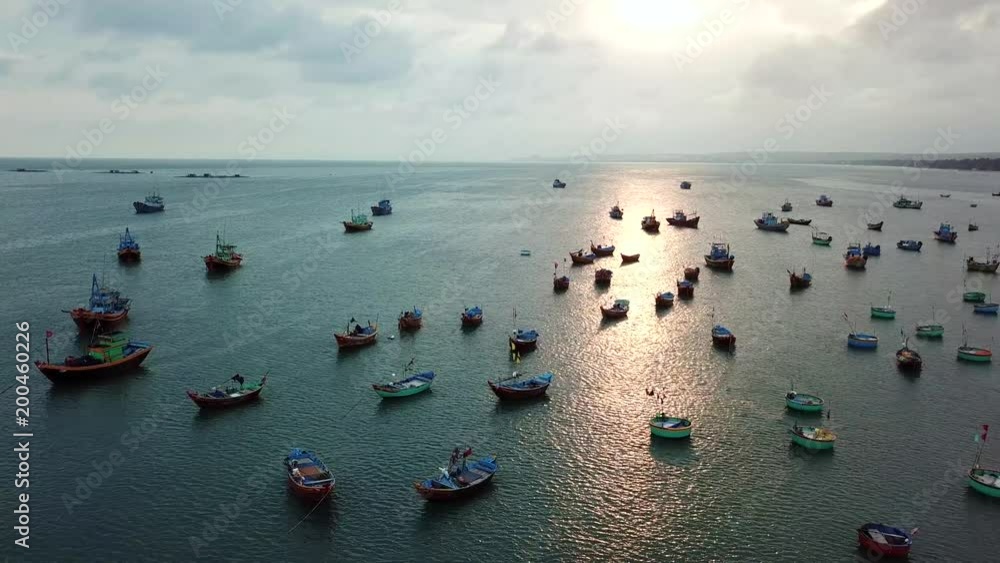 Top view. Aerial view fishing harbour market from drone. Royalty high quality free stock image of market at Mui Ne fishing harbour or fishing village. Fishing harbor is a popular tourist destination Top view. Aerial view fishing harbour market from drone. Royalty high quality free stock image of market at Mui Ne fishing harbour or fishing village. Fishing harbor is a popular tourist destination