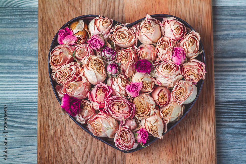 heart of roses on wooden table heart of roses on wooden table