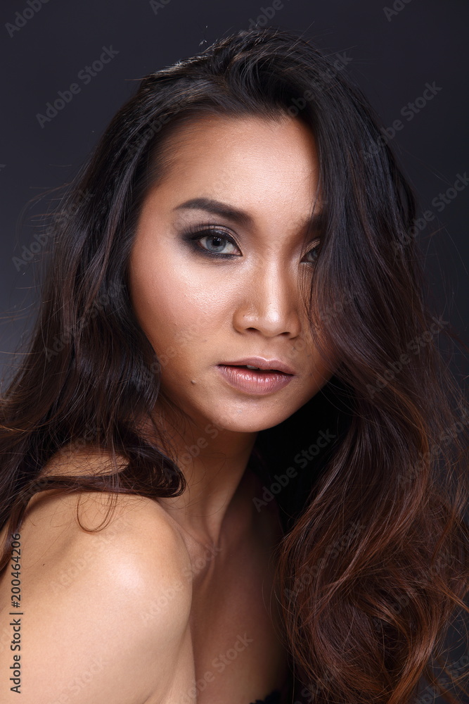 Asian Long straight black hair tan skin woman in Black dress Asian Long straight black hair tan skin woman in Black dress