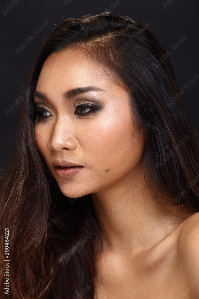 Asian Long straight black hair tan skin woman in Black dress Asian Long straight black hair tan skin woman in Black dress