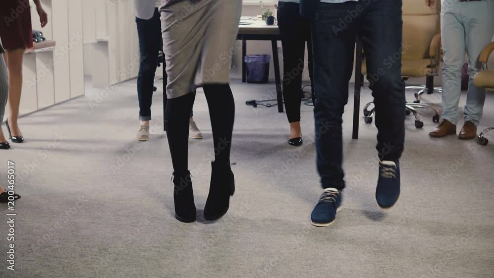 Happy African American friends doing ethnic dance at office party. Multiethnic business people share fun time at work 4K