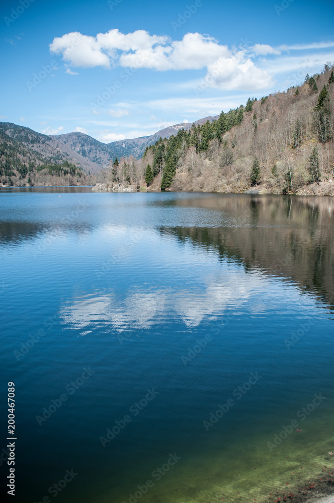 panorama of lake of Kruth with cloud reflection in alsace - France