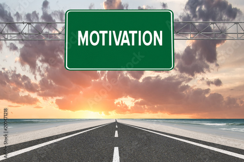 Motivation text on highway sign at beach