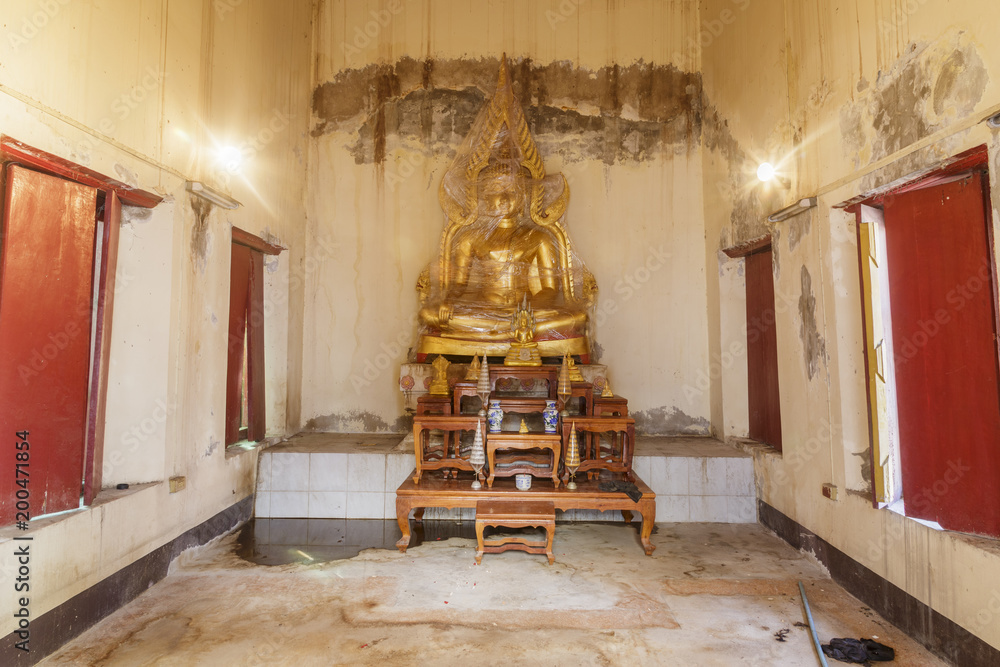 seated Buddha Chinnaratimage in the temple made from mental under cover in old building seated Buddha Chinnaratimage in the temple made from mental under cover in old building