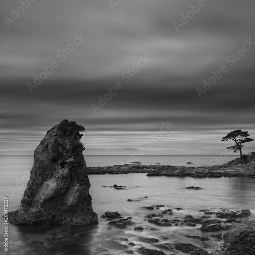 Long exposure black and white view of sea rocks at Tateishi Park, Kanagawa Prefecture, Japan photo