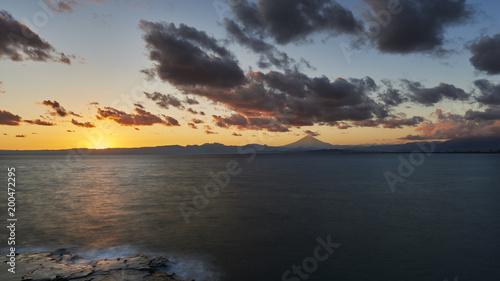 Long exposure of dramatic clouds over Mount Fuji at sunset  Kanagawa Prefecture  Japan