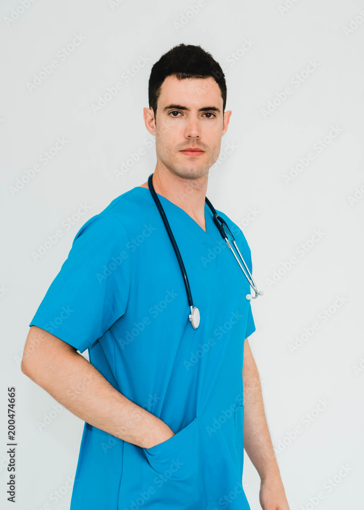 Portrait of handsome doctor standing with stethoscope Portrait of handsome doctor standing with stethoscope