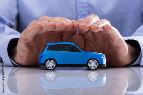 Person Protecting Small Car