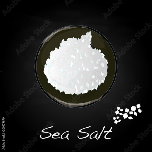 sea salt in ceramic bowl for cooking or spa, isolated on dark background