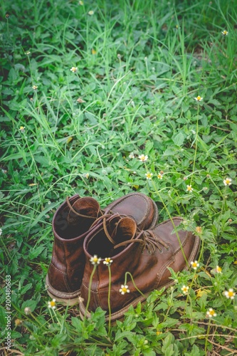 leather shoes on the grass background
