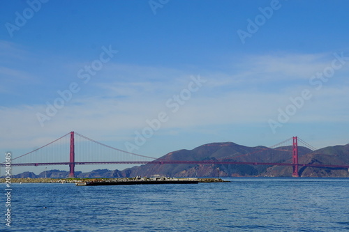 Golden gate bridge with mountain background. © bulentali