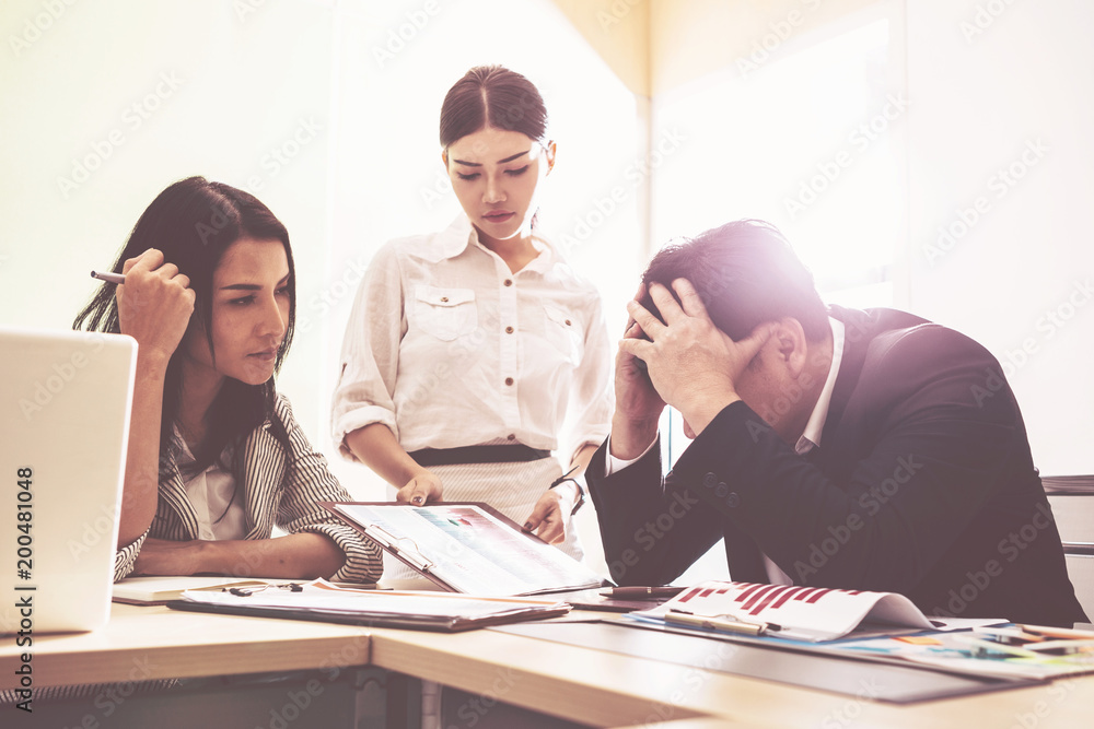businessman thinking and doing plan in office ; feeling worried and tired on business unsuccessful