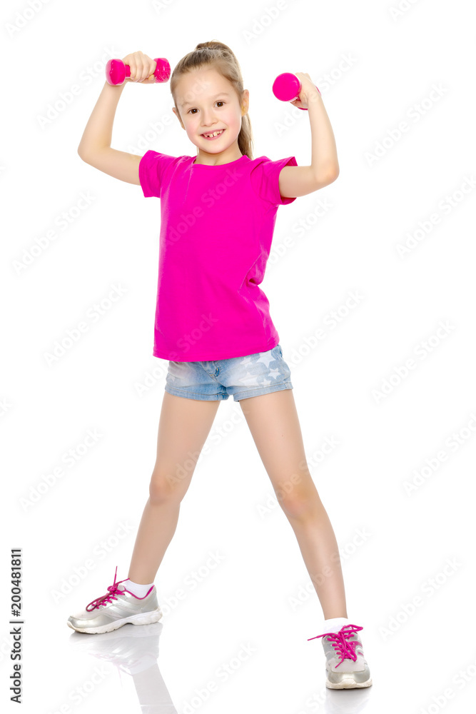 Little girl doing exercises with dumbbells. Little girl doing exercises with dumbbells.