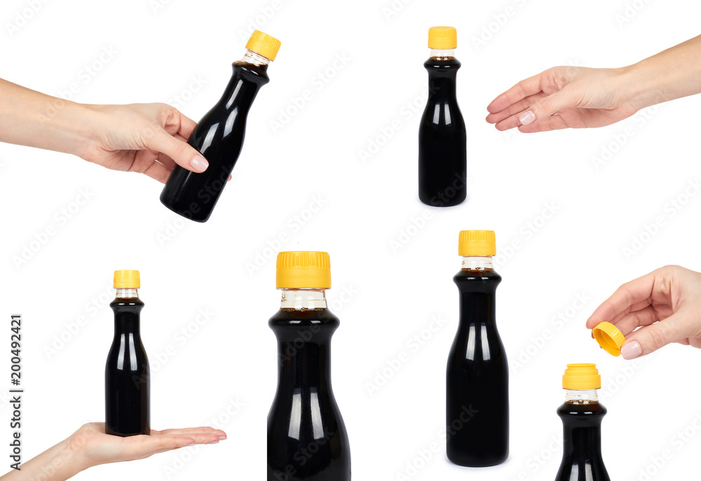 set of different bottle of dark soy sauce or balsamic sauce with hand. Isolated on white background. Yellow cap, asian food, japanese organic seasoning set of different bottle of dark soy sauce or balsamic sauce with hand. Isolated on white background. Yellow cap, asian food, japanese organic seasoning
