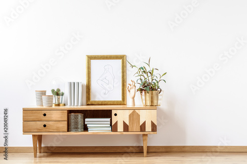 Wooden cabinet by empty wall
