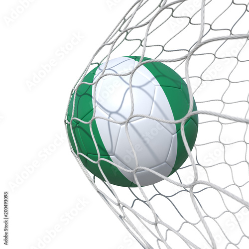 Nigeria Nigerian flag soccer ball inside the net, in a net. © vahekatrjyan
