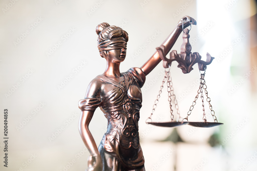 Law symbols on golden bokeh background. Law symbols on golden bokeh background.