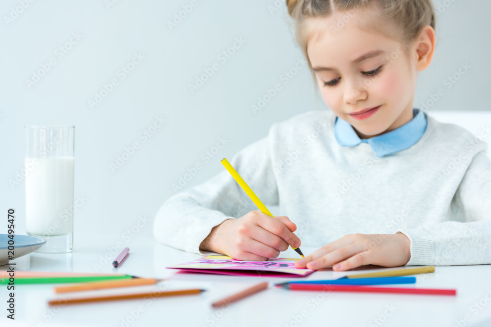 portrait of kid drawing greeting postcard for mother with colorful pencils at table, mothers day holiday concept portrait of kid drawing greeting postcard for mother with colorful pencils at table, mothers day holiday concept