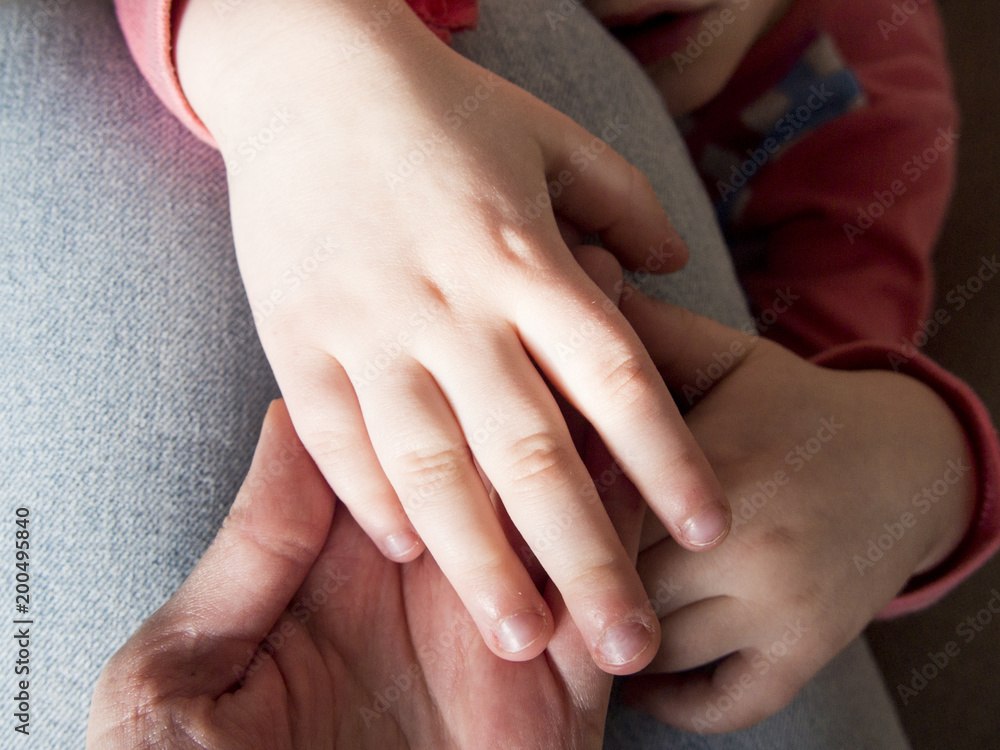hands of a child and an adult hands of a child and an adult