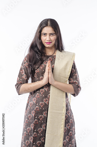 Young woman greeting with a Namaste, India