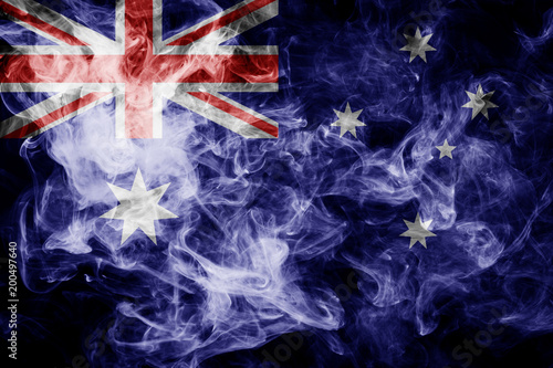 National flag of Australia from thick colored smoke on a black isolated background