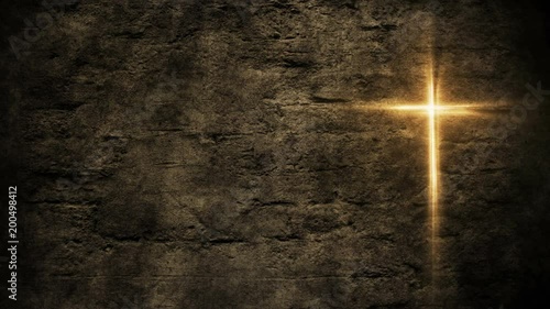 Glowing christian holy cross on cement wall background