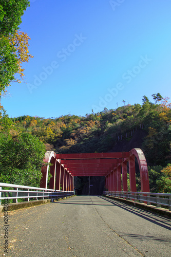 Red iron bridge at Hozukyo in Kyoto, Japan