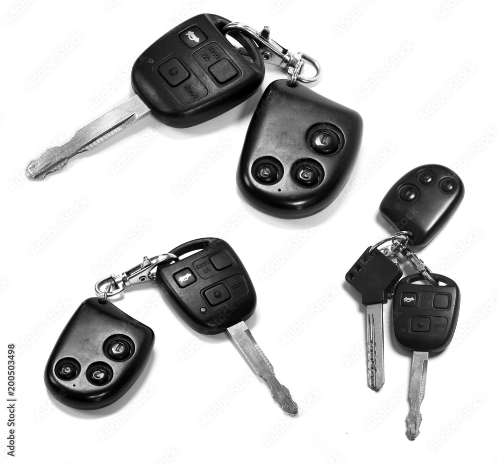 car keys with remotes on white background car keys with remotes on white background