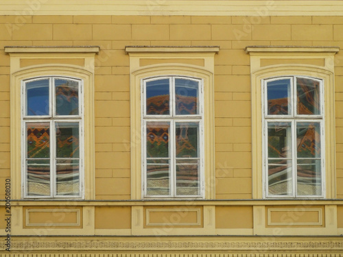 Three windows with reflection