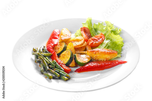 Vegetables grilled portion of side dish on a plate on white isolated background Side view. Appetizing dish for the menu restaurant, bar, cafe