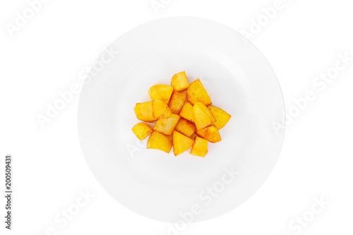 Potatoes diced fried, baked with spices, side dish on a plate on white isolated background view from above. Appetizing dish for the menu restaurant, bar, cafe