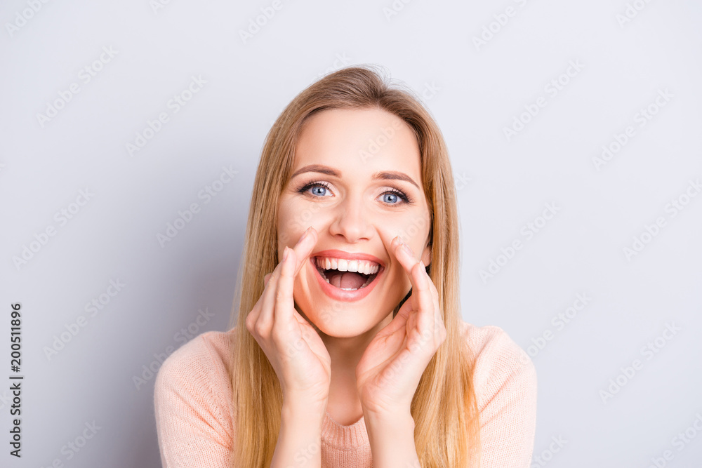 Close up portrait of pretty sweet lovely adorable attractive beautiful charming joking funky funny excited cheerful joyful shouting teen age girl isolated on gray background holding palms near face Close up portrait of pretty sweet lovely adorable attractive beautiful charming joking funky funny excited cheerful joyful shouting teen age girl isolated on gray background holding palms near face