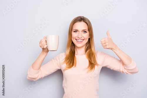 Leisure lifestyle cozy comfort leisure lifestyle latte shop herbal green tea people person cool  concept. Portrait of excited pretty with toothy smile lady advertising cacao isolated gray background