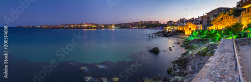 Seaside landscape  panorama  banner - view of the embankment with fortress wall during sunset in the city of Sozopol on the Black Sea coast in Bulgaria