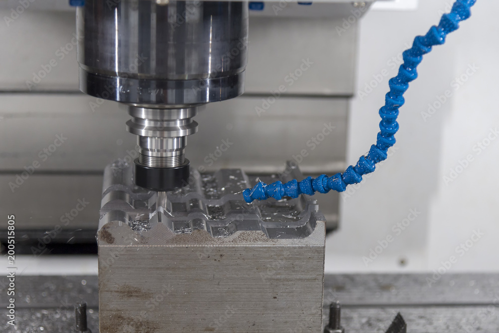 The CNC milling machine cutting the mold part with the solid ball end mill. The CNC milling machine cutting the mold part with the solid ball end mill.