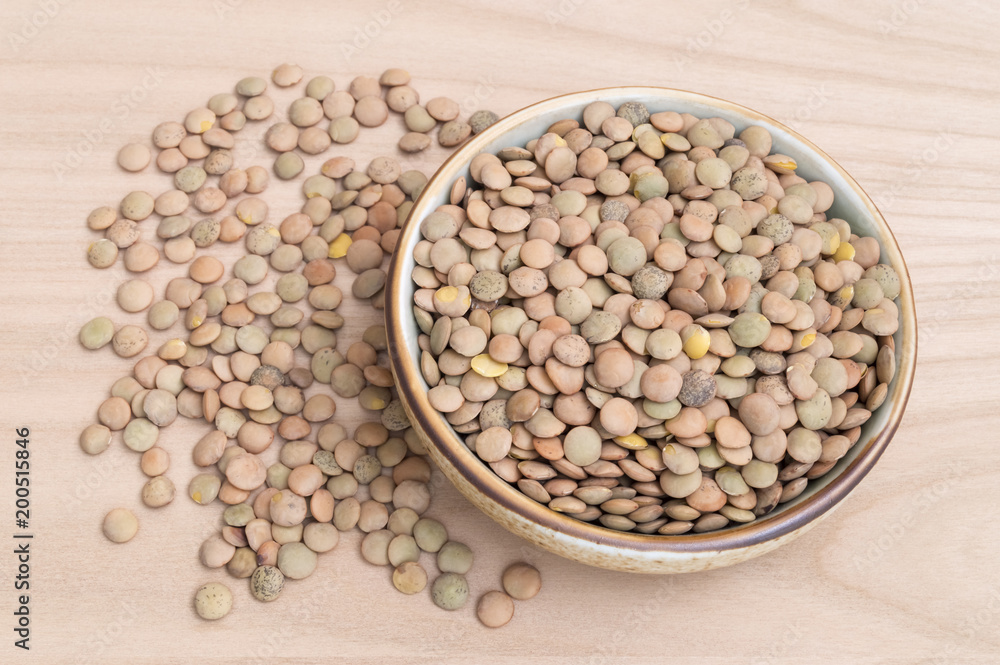 table full of lentils inside a bowl table full of lentils inside a bowl