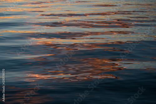 Beautiful reflections on the water at sunset © es12402