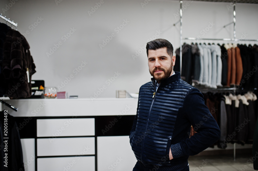 Stylish turkish man at the store of fur coats and leather jackets. Successful arabian beard man. Stylish turkish man at the store of fur coats and leather jackets. Successful arabian beard man.
