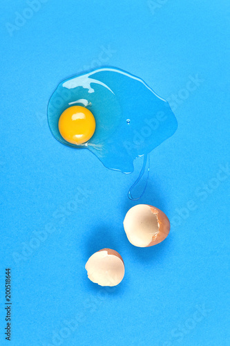 cracked egg on blue background
