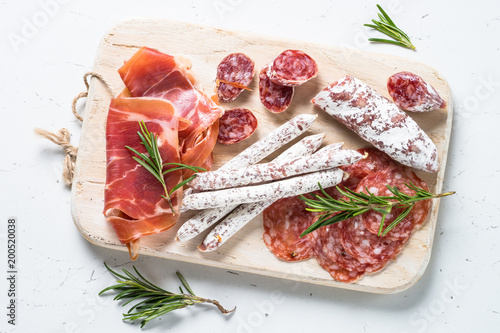 Fotografie Traditional italian antipasto on white.
