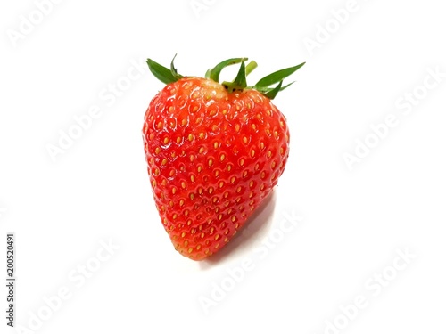 Closeup top view of fresh strawberry on white background.