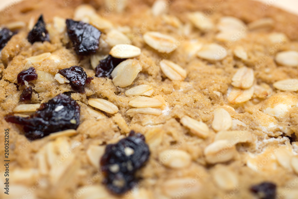 Oat cookie halves on wooden surface Oat cookie halves on wooden surface