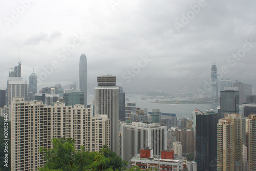 Hong Kong: View from Stubbs Road Lookout across Hong Kong Central to the opposite mainland with a construction site on a rainy summer day