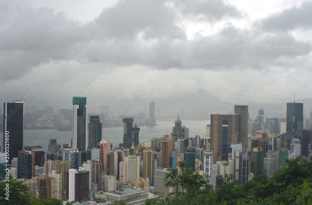 Hong Kong: View from Stubbs Road Lookout across Wan Chai to the opposite mainland on a rainy summer day