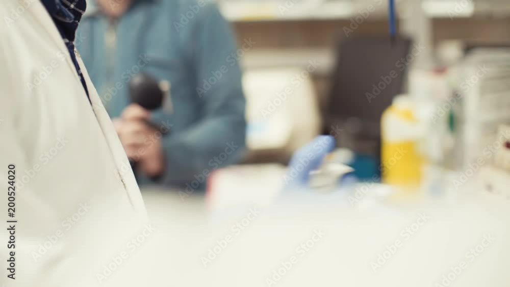 scientist transferring samples from a vial with a micropipette in a laboratory scientist transferring samples from a vial with a micropipette in a laboratory