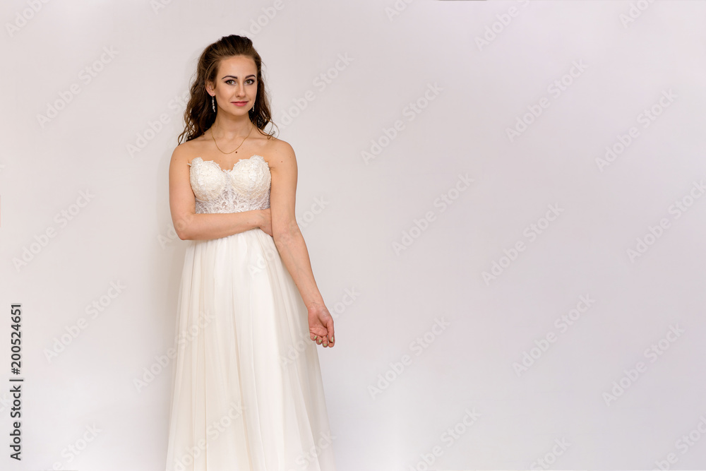 beautiful bride in white wedding dress in different poses on white backgrounds shows different emotions beautiful bride in white wedding dress in different poses on white backgrounds shows different emotions