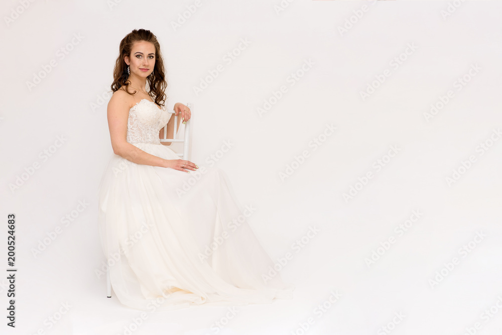 beautiful bride in white wedding dress in different poses on white backgrounds shows different emotions beautiful bride in white wedding dress in different poses on white backgrounds shows different emotions