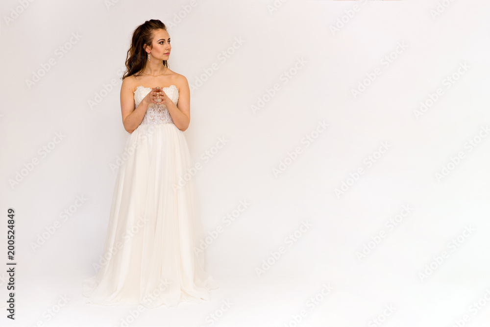beautiful bride in white wedding dress in different poses on white backgrounds shows different emotions beautiful bride in white wedding dress in different poses on white backgrounds shows different emotions