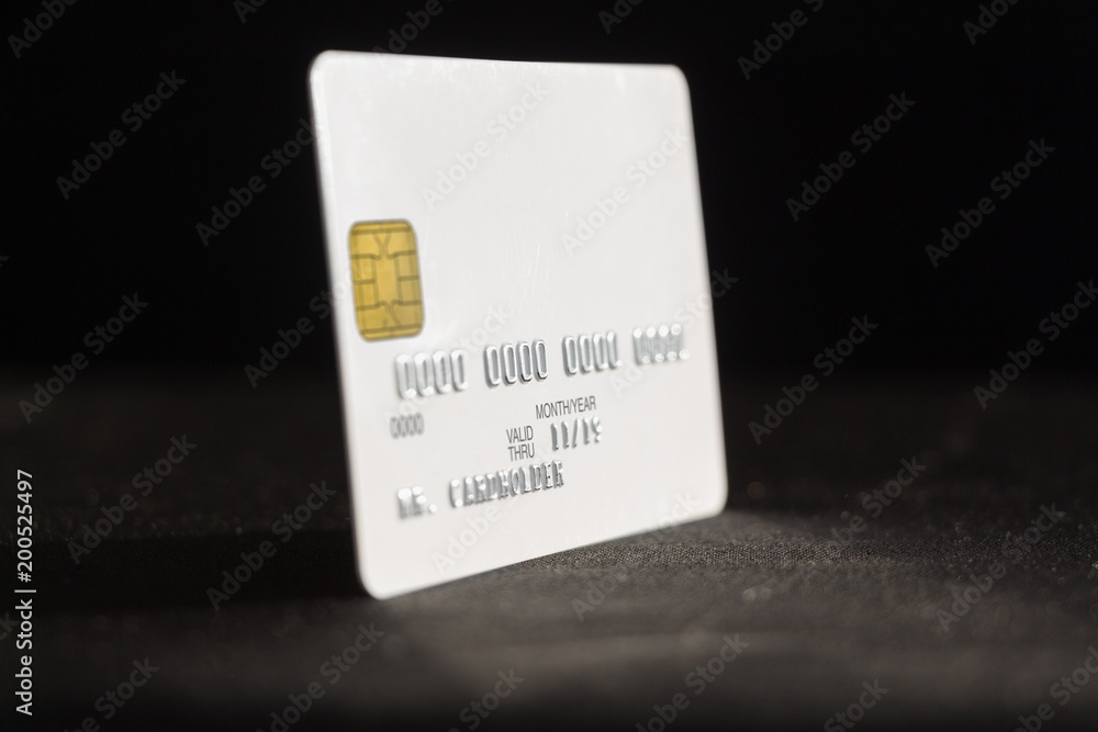 Credit card on dark background, side view Credit card on dark background, side view